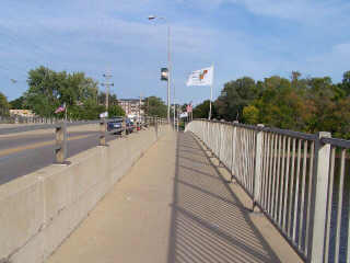 The sidewalk as you cross the bridge